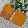 Top e pantalone a trapezio con ricami sul giogo